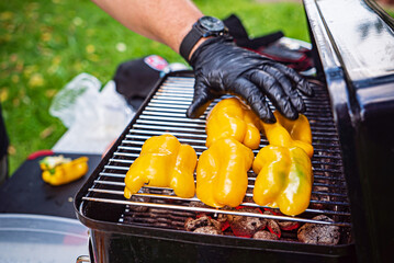 chef making grilled sausage with vegetables