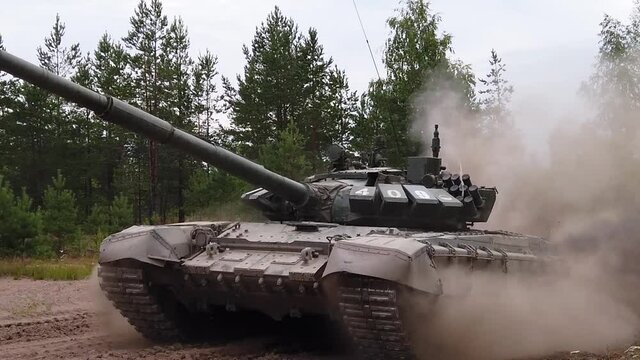 Russian army battle tank on an exercise. Driving a battle tank on a summer day