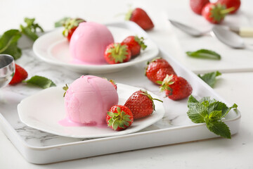Tasty strawberry ice cream on tray