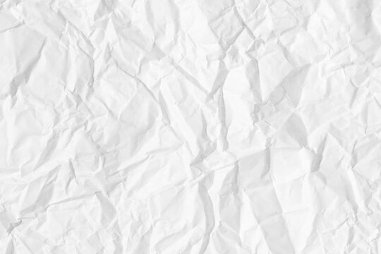 Texture of crumpled white parchment or paper. Abstract background for design. Blank with copy space.