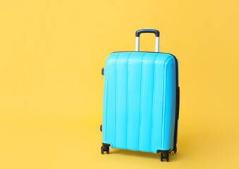 Packed suitcase on color background. Travel concept