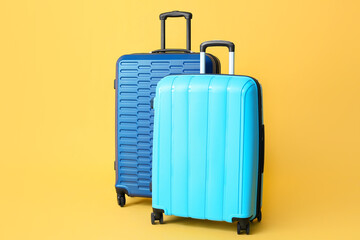 Packed suitcases on color background. Travel concept