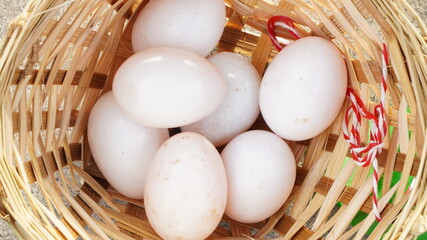 Salted eggs in a bamboo basket in the evening sun
