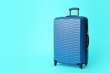 Packed suitcase on color background. Travel concept