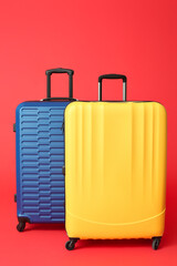 Packed suitcases on color background. Travel concept