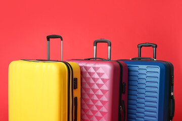 Packed suitcases on color background. Travel concept