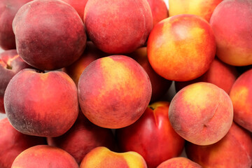 Sweet ripe peaches as background