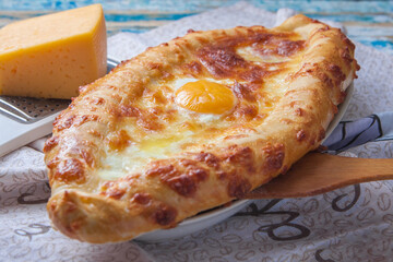 Georgian flatbread with egg on a tray