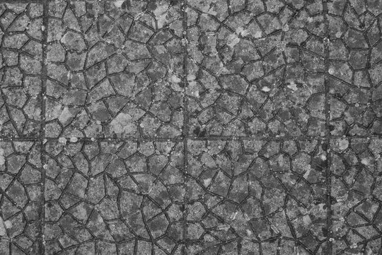 evocative black and white image of tiled floor texture with abstract pattern © massimo