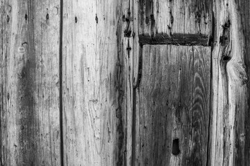 evocative black and white image of texture of old vertical wooden planks