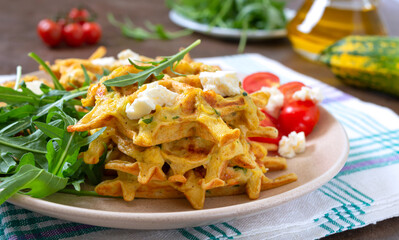Zucchini waffles with goat cheese, tomatoes, arugula. Proper nutrition. Healthly food.