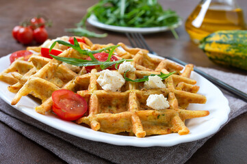 Zucchini waffles with goat cheese, tomatoes, arugula. Proper nutrition. Healthly food.