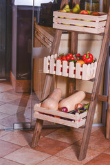 Fresh bio vegetable in a wooden box. Organic raw vegetables, tomatoes, cucumbers, sweet pepper.