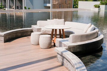 Lounge zone in the hotel near the swimming pool. Leisure time. Hotel business, travel concept, travelling. Empty seats.