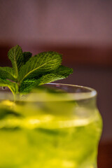 green and yellow drink with mint and ice