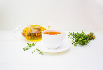 herbal tea with thyme on the white background