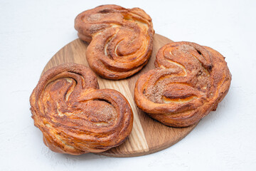 heart shaped bun on a wooden board.isolated on a white background
