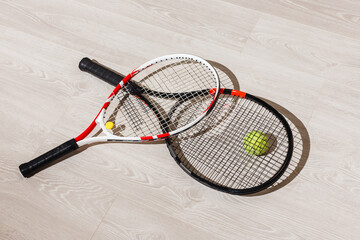Tennis iquipment against a wooden background