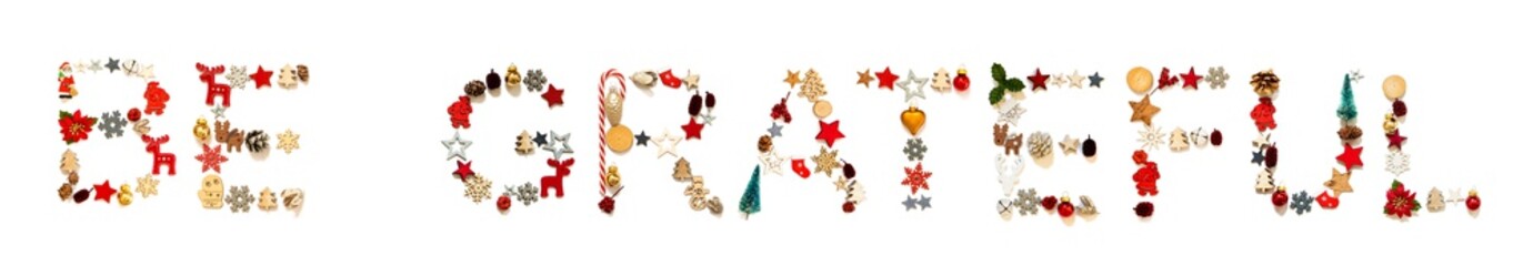 Colorful Christmas Decoration Letter Building English Word Be Grateful. Festive Ornament Like Christmas Tree, Star And Ball. White Isolated Background