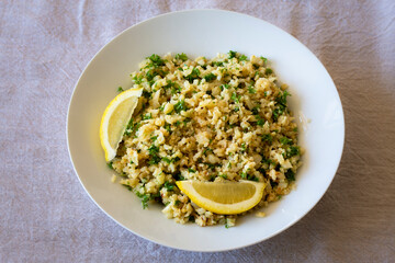 Cauliflower rice with finely chopped parsley with chicken