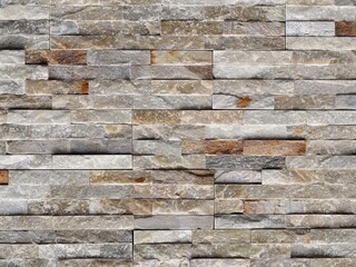 Stone cladding wall made of quartzite tiles, usually used for exteriors . Close up.