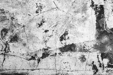 Texture of a concrete wall with cracks and scratches which can be used as a background