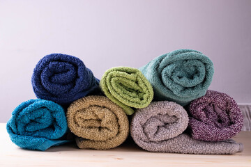 Obraz na płótnie Canvas a group of bath towels in rolls