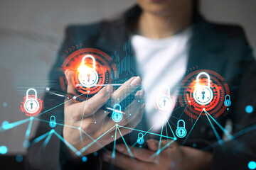 Businesswoman using smart phone in office. Lock icon hologram. Data protection concept. Double exposure.