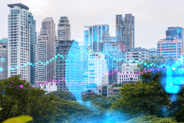 Forex and stock market chart hologram over panorama city view of Bangkok, the financial center in Asia. The concept of international trading. Double exposure.