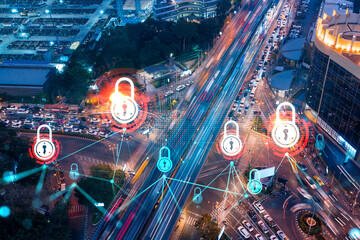 Padlock icon hologram on aerial view of road, busy urban traffic highway at night. Junction network...