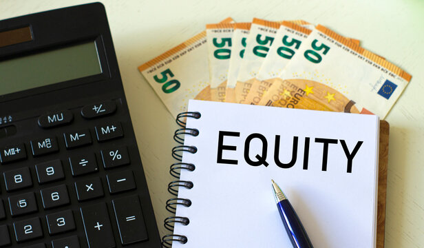 EQUITY word in a notebook against the background of calculitar and banknotes