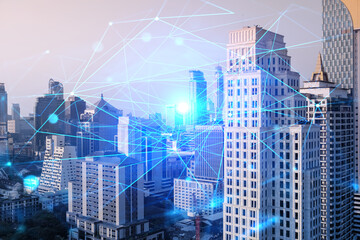 Obraz premium Hologram of abstract technology glowing icons, panoramic cityscape of Bangkok at sunset, Asia. The concept of worlds technological changes. Double exposure.