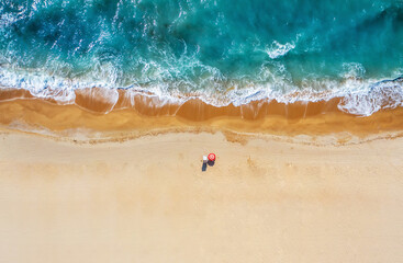 Tropical beach with colorful umbrellas. Picture with drone!