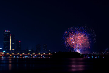 Beautiful Fire works show and reflection on the river,