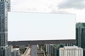 Blank white road billboard with Singapore cityscape background at day time. Street advertising poster, mock up, 3D rendering. Front view. The concept of marketing communication to promote.