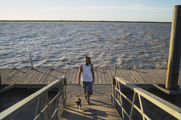 Young male relaxing near the Guadalquivir river in Trebujena, Cadiz, Spain © Miguel Angel Junquera/Wirestock