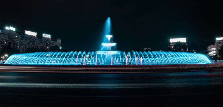 The main colorful artesian fountain in the center of Bucharest seen on a warm summer night. Bucharest, Romania