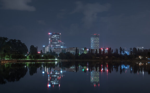 Night view from Bordei Park of the business buildings in the north of the capital. Skytower under a blue night sky. Bucharest, Romania
