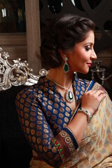 A beautiful Indian model wearing jewelry and bridal dress