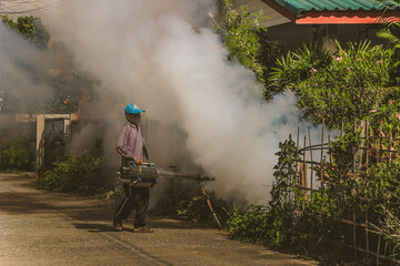 Fototapeta premium Smog officer Mosquito repellent to prevent the occurrence of dengue fever.