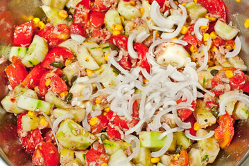Lettuce texture close up. Fresh salad of vegetables, tomatoes and cucumbers.