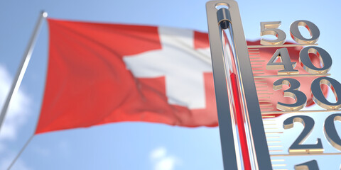 Thermometer shows high air temperature against blurred flag of Switzerland. Hot weather forecast related 3D rendering