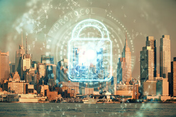 Lock icon hologram on city view with skyscrapers background multi exposure. Data security concept.