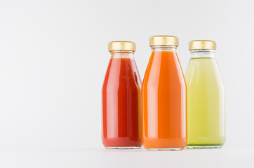 Tomato, carrot, green vegetable juices collection in glass bottles with cap mock up on white background, template for packaging, advertising, design product, branding.