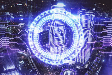 Multi exposure of cryptocurrency theme hologram drawing and city veiw background. Concept of blockchain and bitcoin.