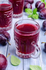 Red plum juice in glass