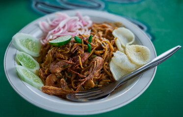 Delicious spicy Chinese noodles with shrimps at Indonesian street food market 
