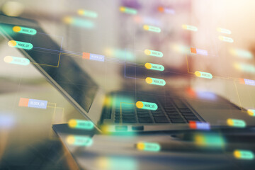 Double exposure of table with computer on background and data theme hologram. Data technology concept.