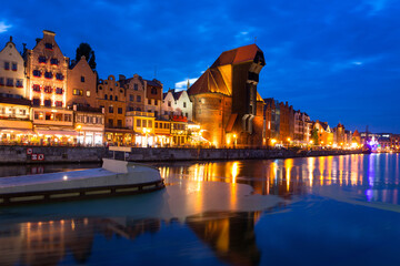 Amazing architecture of Gdansk old town over the Motlawa River at night. © Patryk Kosmider