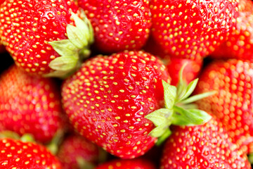 Fresh red srawberry close up background. Macro photo.